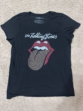 the Rolling Stones Black Tee with White Script Neck Print